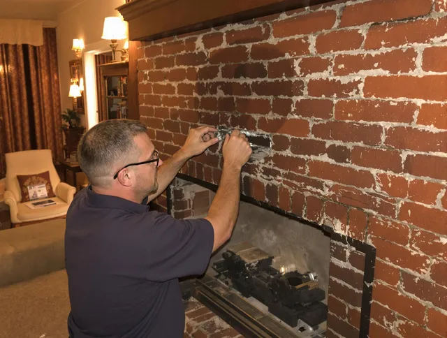 Manhattan Beach Chimney Sweep expert fixing a fireplace in Manhattan Beach, CA